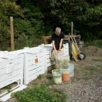 Time to feed the worms! Student Jacob West (Class of 2011) empties the composting buckets into the bins