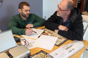 HWE reviewing a no-cost energy report with customer